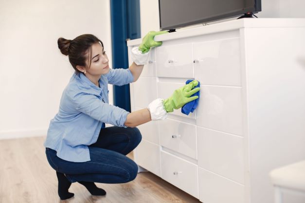 woman-with-sponge-rubber-gloves-cleaning-house